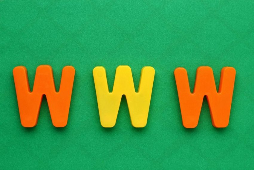 Colourful WWW letters on a green background representing web domain extensions